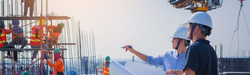 two project managers overlooking construction